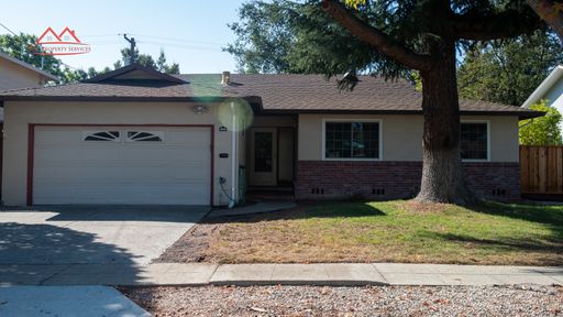 Front exterior of the single-family home at 1581 Vireo Avenue, Sunnyvale, with attached two-car garage and mature front-yard tree