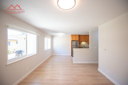 Bright living and dining area with laminate flooring at 229 Greendale Way #2, San Jose