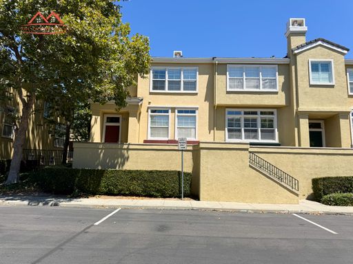 Front exterior of the townhome at 3634 Fitzsimmons Common in the gated Liberty Commons community, Fremont