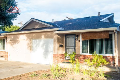 Front exterior of the duplex at 868 Miller Avenue, Cupertino, with attached garage